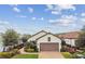 Charming single-story home with a brick driveway, well-maintained landscaping, and a two-car garage at 4257 Rosatti Rd, Wesley Chapel, FL 33543