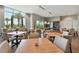 Game room featuring a billiard table and dining tables surrounded by windows at 4257 Rosatti Rd, Wesley Chapel, FL 33543