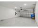 Spacious two car garage with epoxy flooring and ample room for parking and storage at 4257 Rosatti Rd, Wesley Chapel, FL 33543