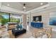 Bright living room featuring hardwood floors, neutral walls, recessed lighting, ceiling fan, and modern furniture at 4257 Rosatti Rd, Wesley Chapel, FL 33543