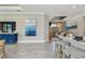 Bright living room features an elegant blue cabinet and decorative wall art at 4257 Rosatti Rd, Wesley Chapel, FL 33543