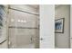 Bathroom featuring enclosed shower with glass doors, tiled walls, modern fixtures, and recessed lighting at 4257 Rosatti Rd, Wesley Chapel, FL 33543