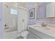 Charming bathroom featuring modern fixtures, vanity, and a shower-tub combo with stylish curtain at 4583 Emprise Way, Land O Lakes, FL 34638