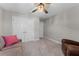 A bedroom with a ceiling fan and neutral carpeting at 4583 Emprise Way, Land O Lakes, FL 34638