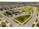 Aerial view showcases a community, pool, playground, and landscaping, creating a welcoming environment at 4583 Emprise Way, Land O Lakes, FL 34638