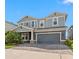 Beautiful two-story home with a spacious two-car garage and beautifully maintained landscaping at 4583 Emprise Way, Land O Lakes, FL 34638