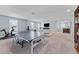 Bright living space with comfortable seating, exercise equipment, and ample natural light, perfect for entertainment and fitness at 4583 Emprise Way, Land O Lakes, FL 34638