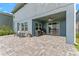 Comfortable covered patio with ceiling fan, outdoor furniture and BBQ, perfect for outdoor entertaining at 4583 Emprise Way, Land O Lakes, FL 34638