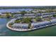 Stunning aerial view of waterfront townhomes with boat docks and lush landscaping along the water's edge at 5242 Beach Se Dr, St Petersburg, FL 33705