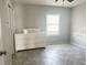 Cozy bedroom featuring tile floors, a window for natural light, and a spacious closet for ample storage at 5242 Beach Se Dr, St Petersburg, FL 33705