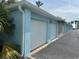 Row of detached garages featuring a clean exterior with roll-up doors for secure parking and storage at 5242 Beach Se Dr, St Petersburg, FL 33705