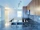 Stylish kitchen featuring granite countertops, stainless steel appliances, and a modern faucet at 5242 Beach Se Dr, St Petersburg, FL 33705
