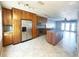 Bright kitchen with stainless steel appliances, a granite island, and a seamless flow to the dining area at 5242 Beach Se Dr, St Petersburg, FL 33705