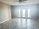 This airy living room has tile floors and French doors leading to a balcony at 5242 Beach Se Dr, St Petersburg, FL 33705