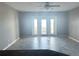This airy living room has tile floors and French doors leading to a balcony at 5242 Beach Se Dr, St Petersburg, FL 33705