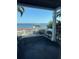 This covered patio has views of the beach and boat lift at 5242 Beach Se Dr, St Petersburg, FL 33705