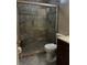 The bathroom boasts a tiled walk-in shower with a built-in bench and glass door at 5242 Beach Se Dr, St Petersburg, FL 33705