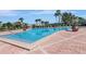 Relaxing community swimming pool with lounge chairs and landscaped greenery at 5242 Beach Se Dr, St Petersburg, FL 33705