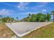 Enjoy a sandy volleyball court with lush greenery and a blue sky backdrop at 5242 Beach Se Dr, St Petersburg, FL 33705