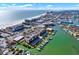 Breathtaking aerial view of coastal condos, beach, and waterways in a vibrant community at 5301 Gulf Blvd # B508, St Pete Beach, FL 33706