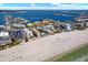 Magnificent aerial view showcases beachfront condos, sandy shores, and the expansive ocean at 5301 Gulf Blvd # B508, St Pete Beach, FL 33706