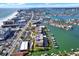 Wonderful aerial view of waterfront condos with boat docks, surrounded by lush landscaping at 5301 Gulf Blvd # B508, St Pete Beach, FL 33706
