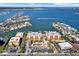 Impressive aerial view of condos near the waterways featuring boat docks and a refreshing pool at 5301 Gulf Blvd # B508, St Pete Beach, FL 33706