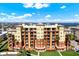 A stunning aerial view of the multi-story building and its manicured landscaping at 5301 Gulf Blvd # B508, St Pete Beach, FL 33706
