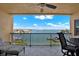Scenic balcony offering panoramic views of the bay, boats, and the horizon under a sunny sky at 5301 Gulf Blvd # B508, St Pete Beach, FL 33706