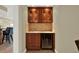Cozy bar area with cabinets, sink, and a wine fridge, adding convenience at 5301 Gulf Blvd # B508, St Pete Beach, FL 33706