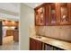 Bar area with custom cabinets, sink, and wine cooler, great for entertaining at 5301 Gulf Blvd # B508, St Pete Beach, FL 33706