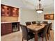 Spacious dining room with wine storage, perfect for entertaining guests at 5301 Gulf Blvd # B508, St Pete Beach, FL 33706