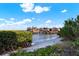 Scenic view of a private boat dock surrounded by lush greenery and tranquil waters at 5301 Gulf Blvd # B508, St Pete Beach, FL 33706