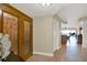 Welcoming entrance area with decorative door and glimpse of kitchen at 5301 Gulf Blvd # B508, St Pete Beach, FL 33706