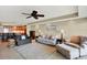 Spacious living room with plush seating, ceiling fan, and an open layout with views to an adjacent kitchen at 5301 Gulf Blvd # B508, St Pete Beach, FL 33706