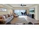 Comfortable living room leads to a balcony overlooking the water, perfect for relaxing and enjoying the view at 5301 Gulf Blvd # B508, St Pete Beach, FL 33706