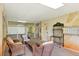 Well-lit condo lobby featuring cozy wicker furniture and convenient mailboxes at 5301 Gulf Blvd # B508, St Pete Beach, FL 33706