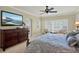 Well-lit bedroom with a dresser, large windows, and comfortable armchairs at 5301 Gulf Blvd # B508, St Pete Beach, FL 33706