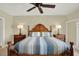Spacious main bedroom featuring a decorative wooden headboard and side tables at 5301 Gulf Blvd # B508, St Pete Beach, FL 33706