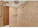 Tiled walk-in shower with a handheld shower head and rainfall shower head at 5301 Gulf Blvd # B508, St Pete Beach, FL 33706