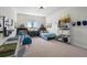 Shared bedroom has two beds, wall decor, bright light fixture and a window view at 5409 Del Coronado Dr, Apollo Beach, FL 33572