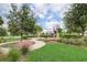 Community playground with modern equipment, mature trees, and walking paths at 5409 Del Coronado Dr, Apollo Beach, FL 33572