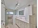 Modern bathroom with glass-enclosed shower and vanity with ample counter space at 5785 Bay Pines Lakes Blvd, St Petersburg, FL 33708