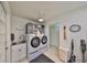 Convenient laundry room featuring modern appliances and a utility sink at 5785 Bay Pines Lakes Blvd, St Petersburg, FL 33708