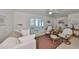 Bright living room with tiled floors, neutral decor, plush seating and an abundance of natural light at 5785 Bay Pines Lakes Blvd, St Petersburg, FL 33708