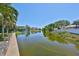 Scenic pond view with fountain and lush landscaping, providing a peaceful backdrop for the property at 5785 Bay Pines Lakes Blvd, St Petersburg, FL 33708