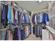 Spacious walk-in closet with ample hanging space and shelving for organized storage at 5785 Bay Pines Lakes Blvd, St Petersburg, FL 33708