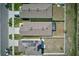Overhead view of residences highlighting a backyard with a screened-in patio and white fence at 588 Olive Conch St, Ruskin, FL 33570