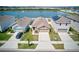 This residential property features a serene pond view and a well-maintained lawn at 588 Olive Conch St, Ruskin, FL 33570
