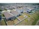 Wide aerial view displays a community with many backyards, some with screened patios at 588 Olive Conch St, Ruskin, FL 33570